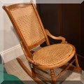 F53. Caned rocking chair. 